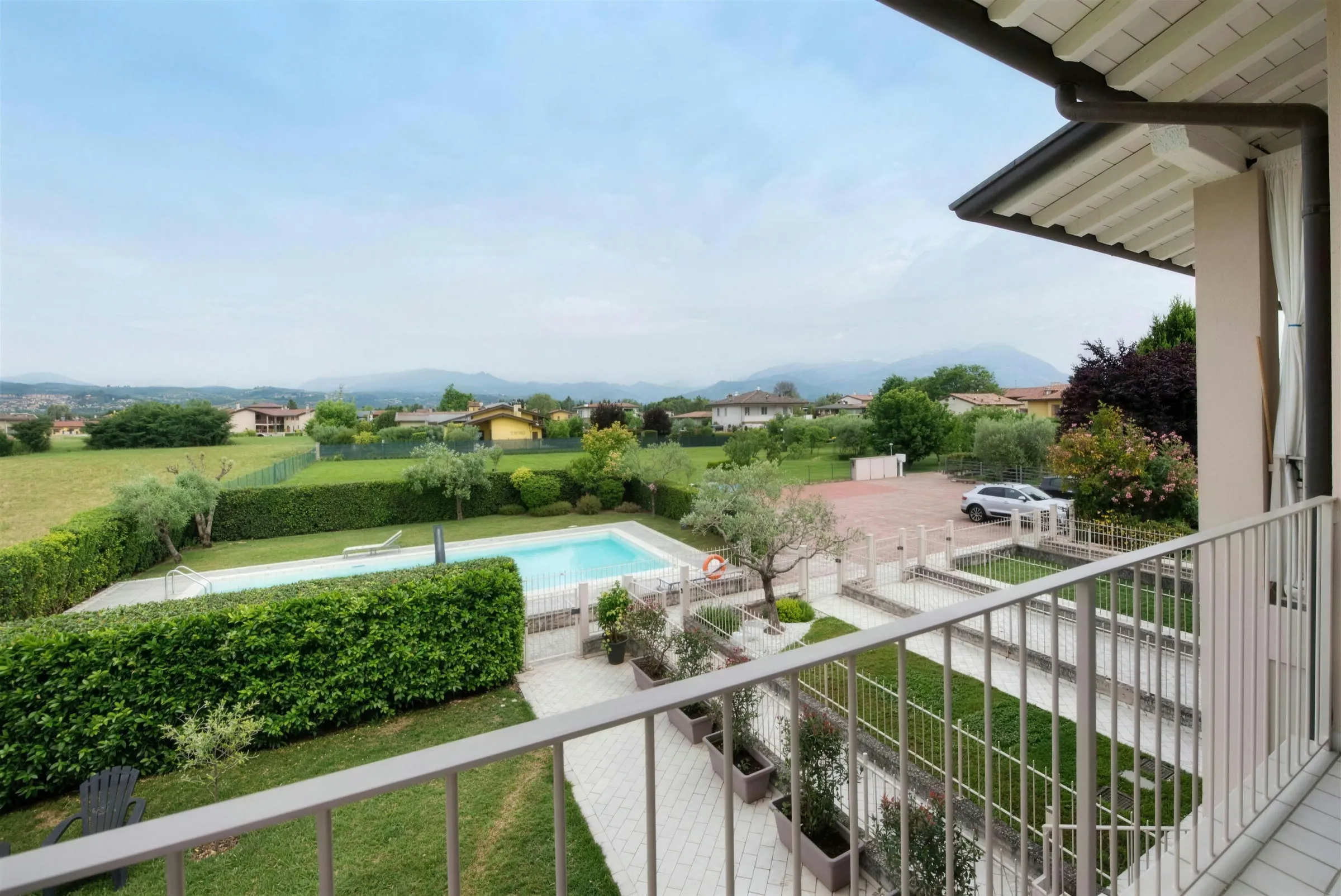 Balcony view over the pool and hills